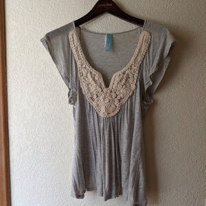 Delicate crocheted top with fluttery sleeves